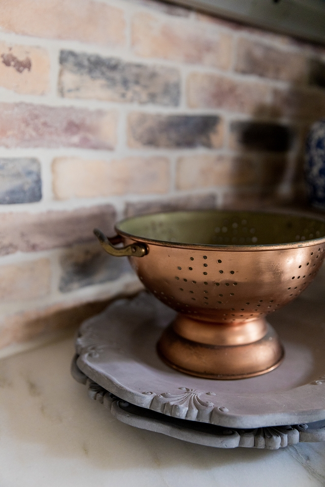 Copper A touch of copper brings a French country feel to this kitchen #copper #Frenchkitchen