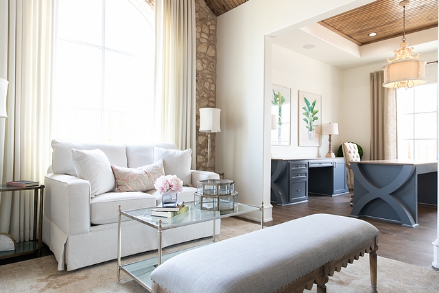 Master bedroom sitting area opens to a home office with custom cabinet and built in desk #homeoffice #masterbedroom