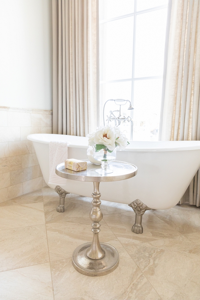 A cast iron clawfoot tub brings a traditional French feel to this bathroom