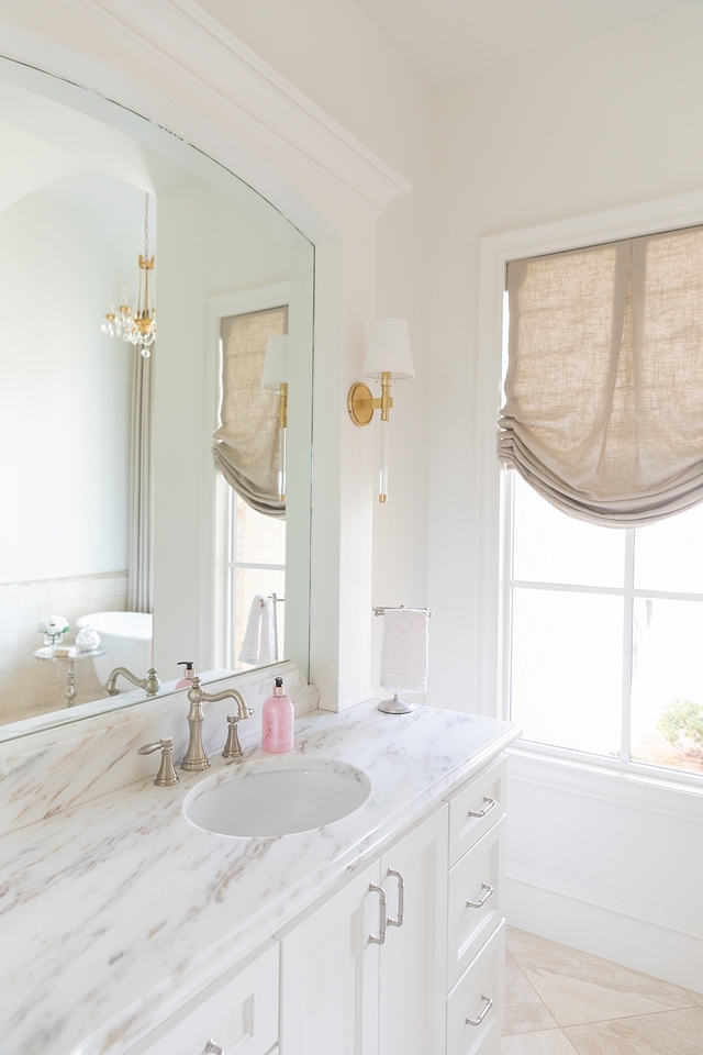 Bathroom white paint color is Sherwin Williams Alabaster Bathroom Countertop is Honed Imperial Danby Marble #bathroom #paintcolor #countertop