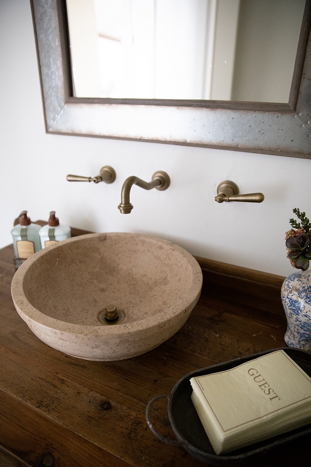 Antique Brushed brass wall mounted faucet and stone vessel sink #bathroom