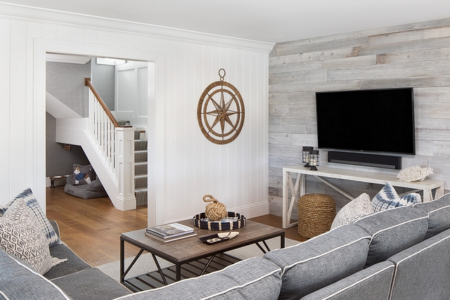 This cozy tv room features a combination reclaimed shiplap and tongue and groove wall paneling #shiplap #tongueandgroove #wallpaneling #paneling