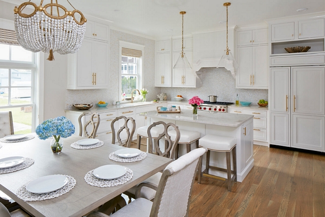 Coastal kitchen with beautiful white cabinets and white pearl mosaic backsplash #kitchen whitekitchen #coastalkitchen #whitepearltile #mosaicbacksplash #mosaictile