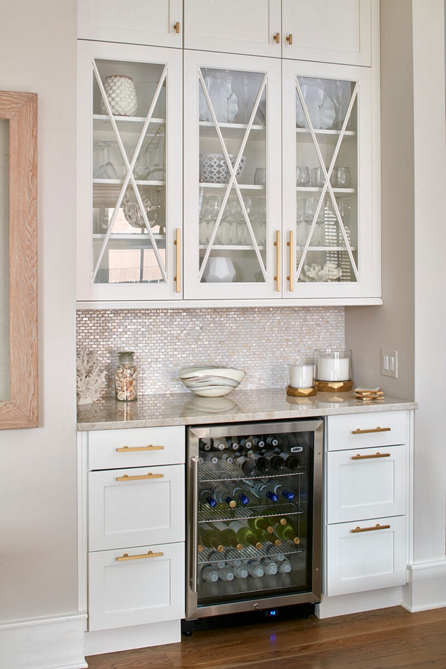 Bar Kitchen Bar The kitchen bar features the same Taj Mahal Quartzite, White Pearl Mosaic Tile Notice and glass cabinet doors with X mullions #kitchen #bar #kitchenbar #Bar #Kitchen #Bar #TajMahalQuartzite #glasscabinetdoors #Xmullions