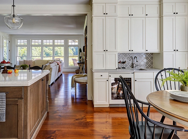 KItchen Wet Bar On the opposite wall from the breakfast nook, a wet bar with white stacked shaker cabinetry provides plenty of closed storage KItchen Wet Bar KItchen Wet Bar KItchen Wet Bar #Kitchen #WetBar #stackedshaker #cabinetry