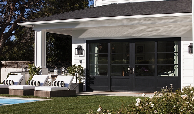 Black Metal Door Black metal patio doors contrast with the white exterior #BlackMetalDoor #Blackmetalpatiodoor