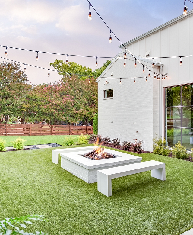 Painted Brick Firepit Benches are DIY, painted in Benjamin Moore Chantilly Lace to match the brick firepit Benches are DIY, painted in Benjamin Moore Chantilly Lace to match the brick firepit and brick siding #brickfirepit #firepit #backyard #paintedbrick