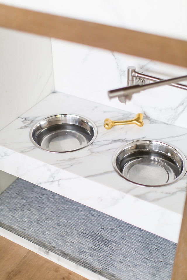 Pet Food Station Customizing a pet food station in your kitchen island isn't only a brilliant idea but it also very functional. It's easy to keep the dogs' food station fresh and cleaner with a pot filler and by being so close to a sink and the dishwasher #Pet #Petfoodstation #petstation