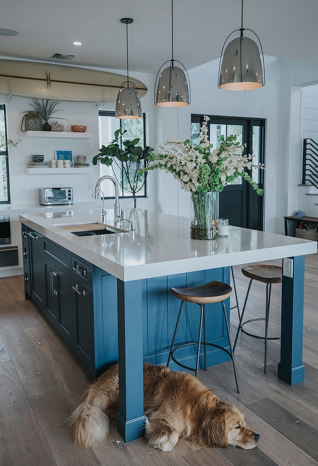 The table end on the island was a very important aspect to the island’s design. The owners wanted a place for their children to do homework The intentional simplicity of the square legs and the 6” custom V-groove panel end reflect the simplicity of their lifestyle #kitchenisland #islanlegs #kitchenislanddesign