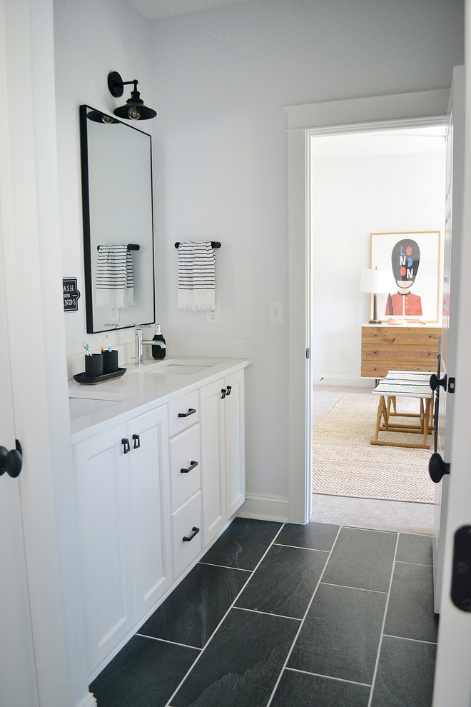 Tiling is12x24 black tile with brite white perma color grout on the floor