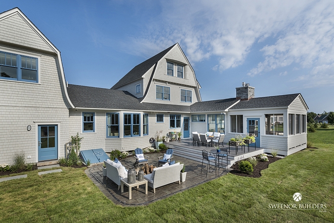 The backyard features a bi-level deck and patio with an outdoor firepit