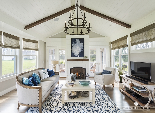 A vaulted ceiling with white-painted V-groove boards distinguishes the living area