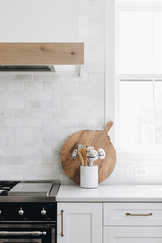 Backsplash is Carrara Marble in honed tile