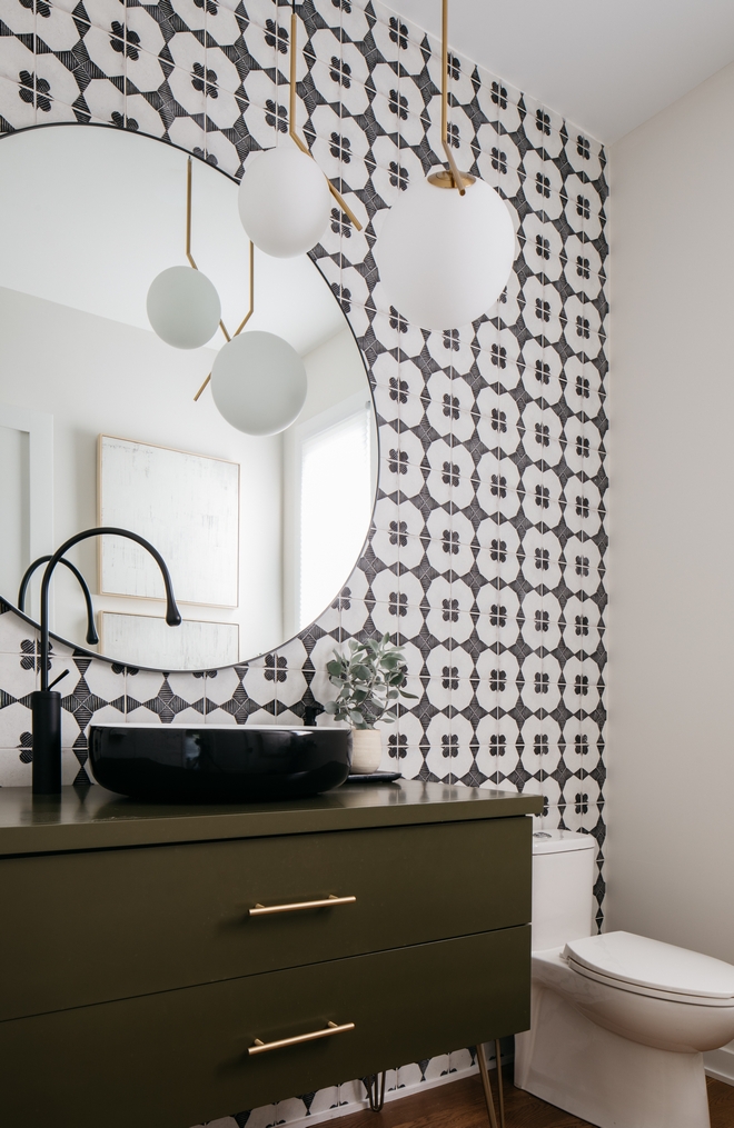 Bathroom features a black and white accent wall tile