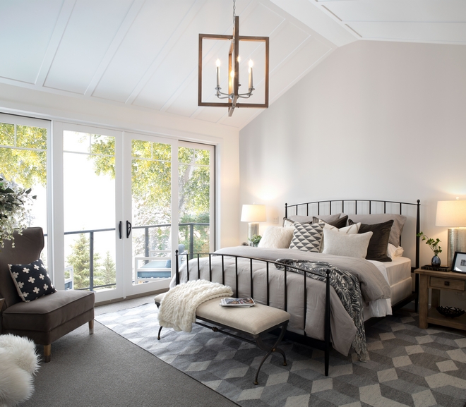 Master Bedroom features vaulted ceilings with custom millwork and a private balcony facing the backyard