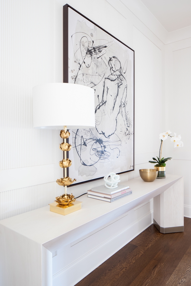 The master hallway is a place where we actually added some of the most detail. This space felt drab and boring before we decided to do the custom reeded panels throughout. We had to design the space and talk the builder in to helping fabricate each panel, but it was totally worth it in the end. This space leads you directly into the master bedroom