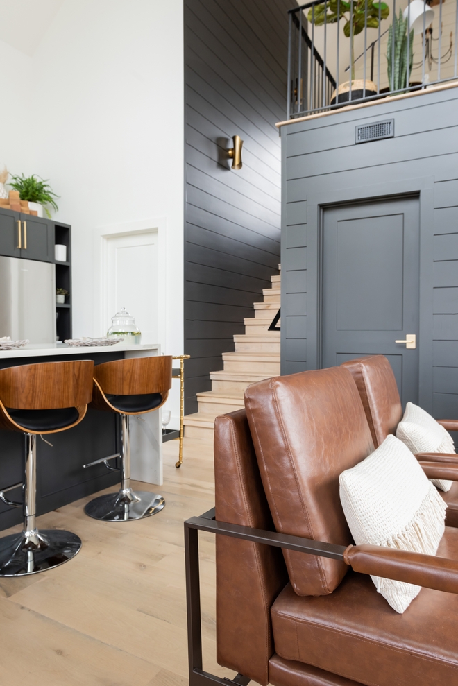 Modern Farmhouse Staircase features White Oak treads/risers and double nickel gap spacing in Sherwin Williams Iron Ore Modern Farmhouse Staircase