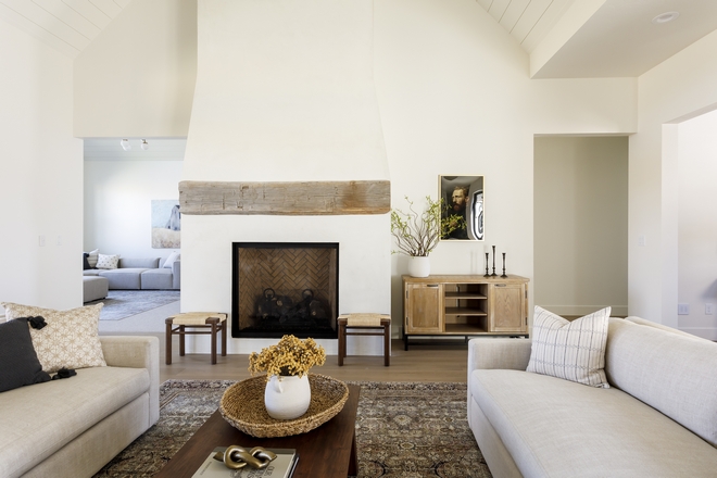 Stucco Fireplace with chunky reclaimed beam mantel