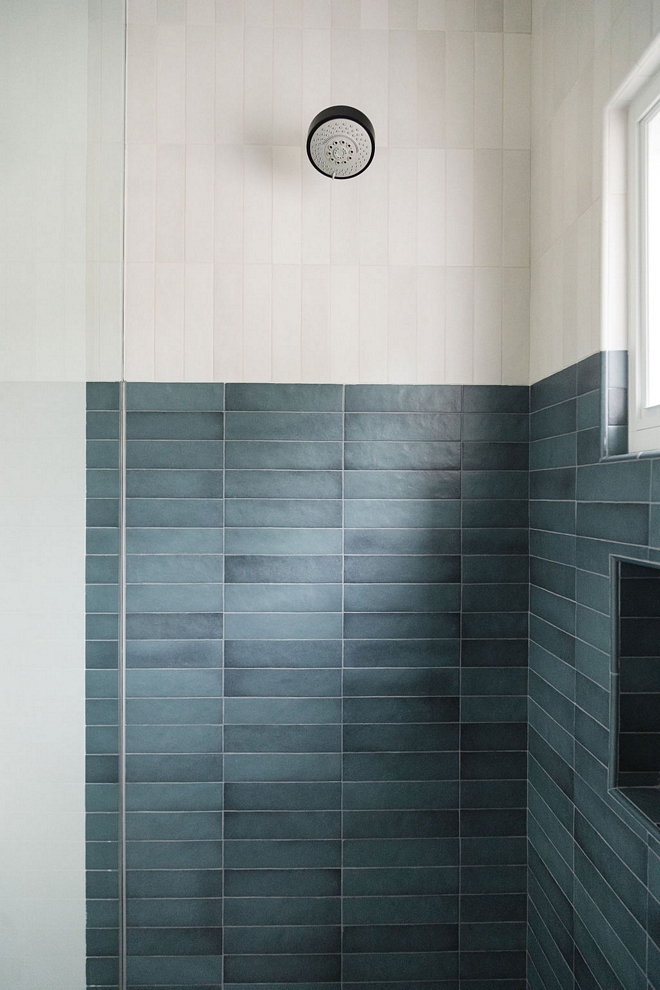 Bathroom features a two-toned shower with vertical and horizontal stacked tiles