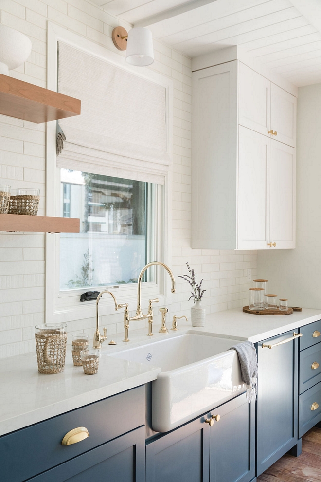 Blue and white two-toned kitchen with Carrara Marble Quartz Countertop