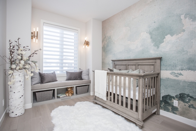 Nursery Mural The mural anchored the room and was complimented by a custom window seat and beautiful wall sconces A faux fur rug and many pillows were added for soft textures #nursery #Nurserydecor #mural