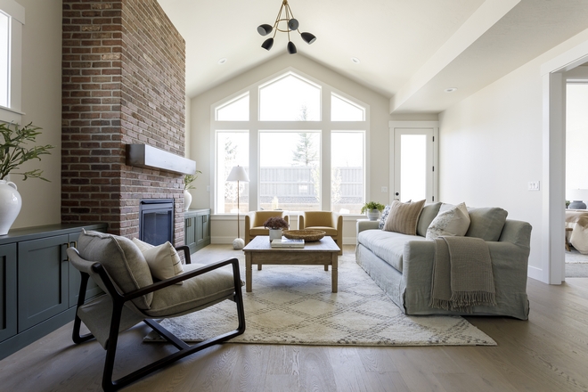 We love the mix of the full height brick on our fireplace with the green cabinetry