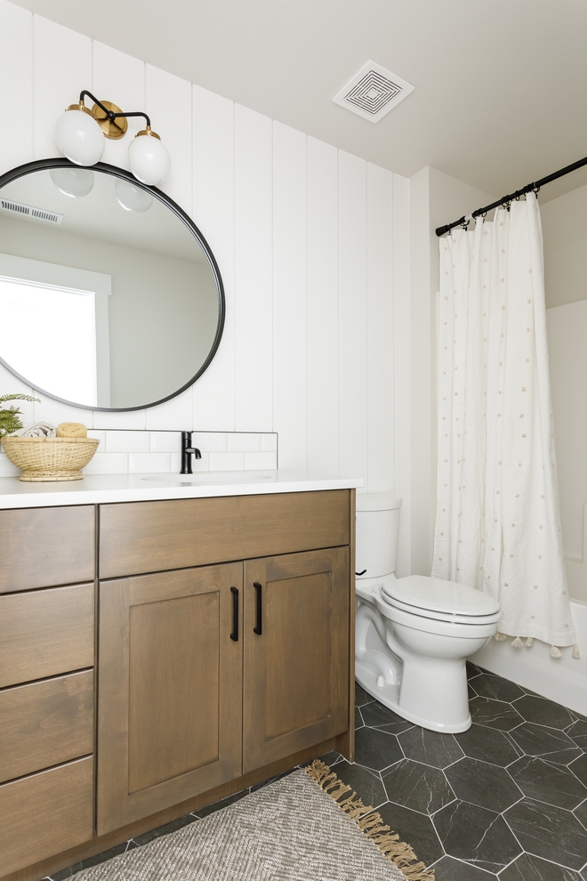 Bathroom Ideas Vertical shiplap is complemented by Petra Marble Hexagon tiles and a custom vanity in a warm tone