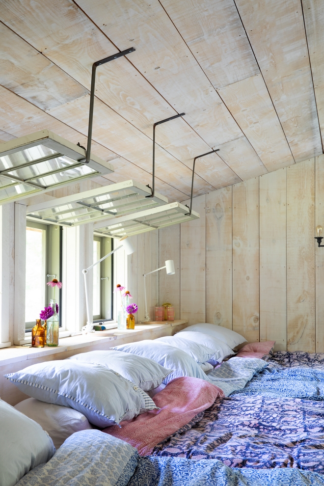 The metal straps for the windows riff off the ones in the Boat House it’s a great way to get a lot of breeze and light into the cottage Cottage Windows Barnwood whitewashed whitewash