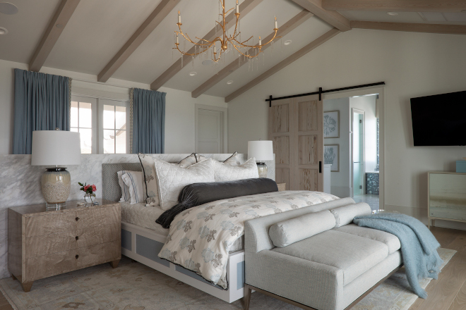 Featuring a custom marble wall with cabinets on the other side and dreamy ocean views, this truly is the ultimate beach house bedroom