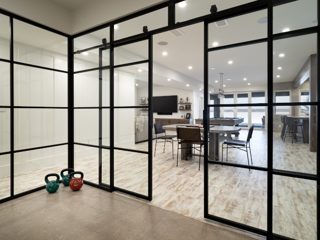 Home Gym The fitness room on the lower level is also enclosed with steel framed glass and sliding doors Home Gym Home Gym Home Gym The fitness room on the lower level is also enclosed with steel framed glass and sliding doors Home Gym Home Gym #HomeGym #fitnessroom #steelenclosed #steelframedglass #slidingdoors