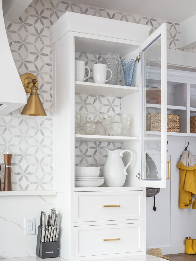 Leaving the back of the upper cabinet open and adding the same backsplash tile adds interest and it extends this entire wall giving the impression of a bigger space