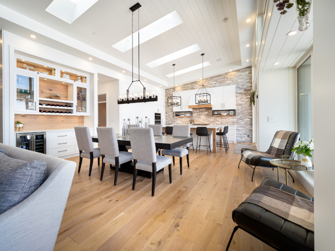 Modern Farmhouse Interior Design Influences Finishes throughout the home stay consistent yet beautiful with warm oak wood, black and bronze fixtures to contrast the bright white walls and cabinetry #ModernFarmhouse #InteriorDesign #ModernFarmhouseInfluences #ModernFarmhouseInteriorDesign #Finishes #home #oakwood #wood #oak #blackfixtures #bronzefixtures #brightwhitewalls #whitecabinetry