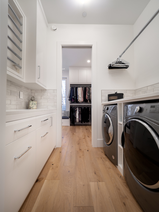 Walk in Closet and Laundry Room walk-in closet with custom built-ins is adjacent to the upper floor laundry room that features an integrated drying rack Walk in Closet and Laundry Room walk-in closet with custom built-ins is adjacent to the upper floor laundry room that features an integrated drying rack #WalkinCloset #LaundryRoom #closet #upperfloorlaundryroom