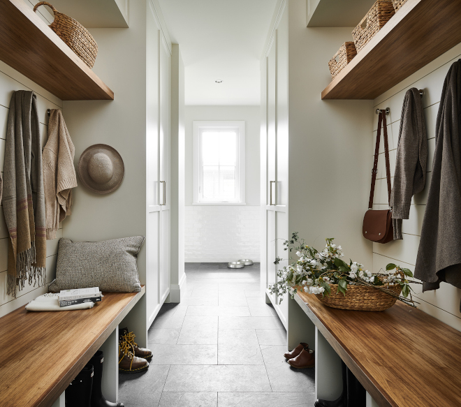 Mudroom custom cabinetry optimizes floor to ceiling storage with custom Walnut built in bench Mudroom #Mudroom #customcabinetry #floortoceiling #storage #Walnutbench #walnutshelf #builtinbench #Mudroombench