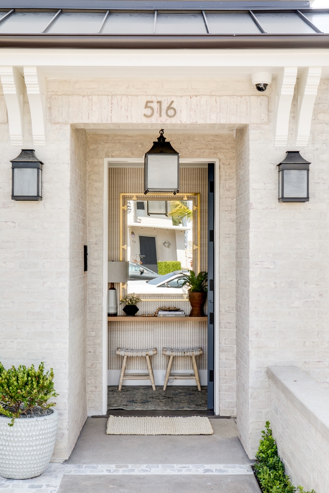 California Beach House Traditional elements like the overhang and corbels along with the whitewashed brick siding match the coastal aspect of the community in this area #California #BeachHouse #Traditionalelements #overhang #corbels #whitewashedbrick #siding #coastal