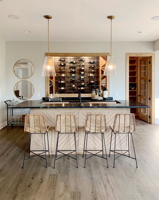 Bar Basement Bar Bar island has a custom chevron detail and a window showcases the Wine Cellar with Pine shiplap walls Bar Basement Bar Bar island #Bar #Basement #BasementBar #Barisland #Winecellar