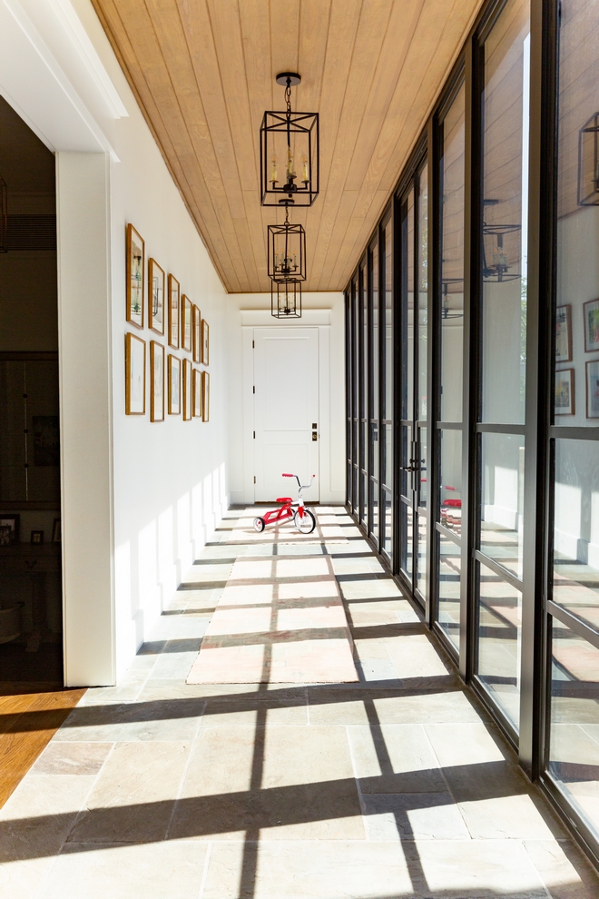 Hallway windows Floor-to-ceiling windows and door in long hallway with bluestone flooring and white oak shiplap ceiling #Hallway #windows #Floortoceilingwindows #door #longhallway #bluestone #flooring #whiteoak #shiplap #ceiling