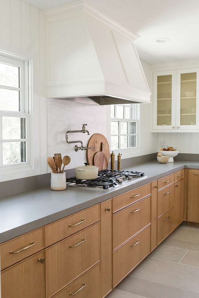 Kitchen backsplash Arizona Tile Calcatta Caldia Slab beneath the hood with MSI Matte Fossil Grey Quartz