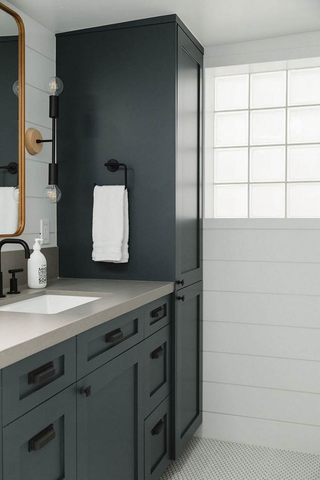 Bathroom Linen Cabinet A custom linen cabinet tower adds more storage to this bathroom