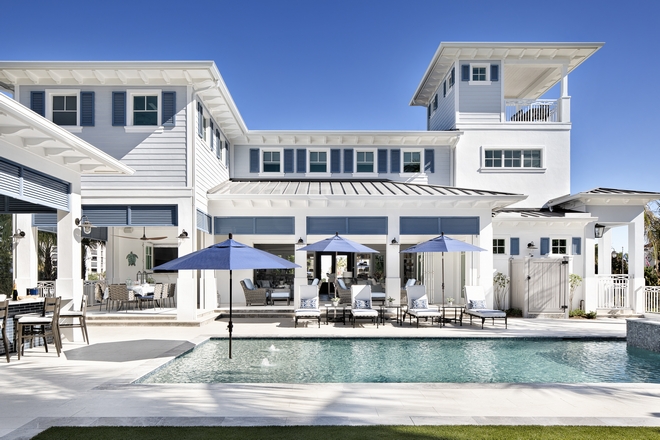 Backyard with pool The designer carried through palette of blues and similar materials to make the transition from indoor to outdoor seamless #backyard #pool