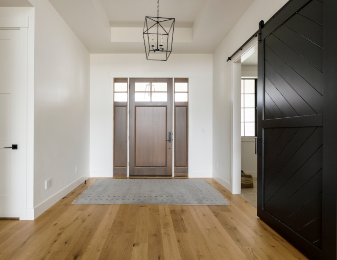 A stained front door with sidelights welcomes you into this newly-built home Warm White Oak hardwood floors ground the main spaces A stained front door with sidelights welcomes you into this newly-built home Warm White Oak hardwood floors ground the main spaces A stained front door with sidelights welcomes you into this newly-built home Warm White Oak hardwood floors ground the main spaces #stainedfrontdoor #frontdoor #frontdoorsidelights #newlybuilthome #WhiteOak #hardwoodfloors