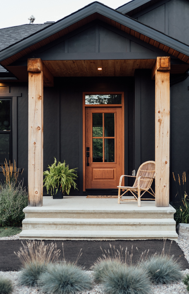 Black Modern Farmhouse with Fiberglass Oak Front Door and Timber Posts Black Modern Farmhouse Black Modern Farmhouse with Fiberglass Oak Front Door and Timber Posts Black Modern Farmhouse #BlackModernFarmhouse #FiberglassOakdoor #FrontDoor #TimberPosts #Black #ModernFarmhouse