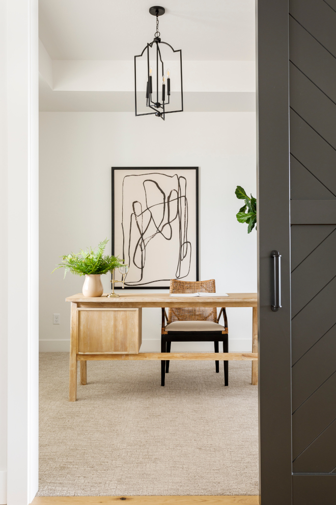 Just off the Foyer you will find a conveniently located Home Office A black barn door brings it some privacy Home Office Barn Door Black and white #HomeOffice #Office #blackbarndoor #BarnDoor #Blackandwhite