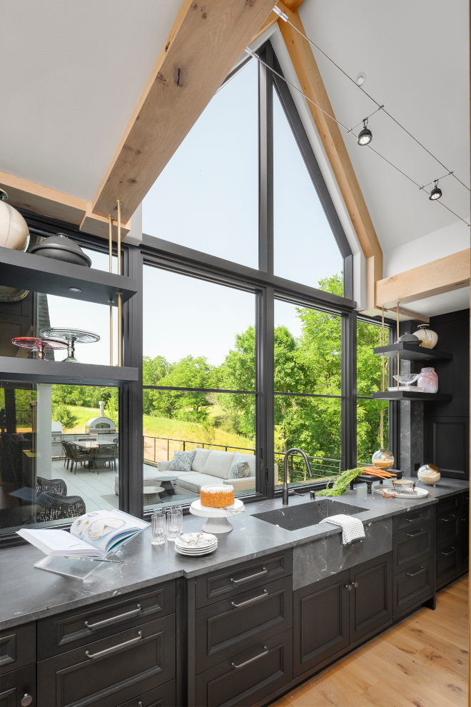 Kitchen Window Kitchen Sink Window Vaulted Ceiling White Oak Trusses frame the stunning windows which open for an extended bar top on the other side #Kitchen #Window #KitchenWindow #SinkWindow #VaultedCeiling #WhiteOakTrusses #windows