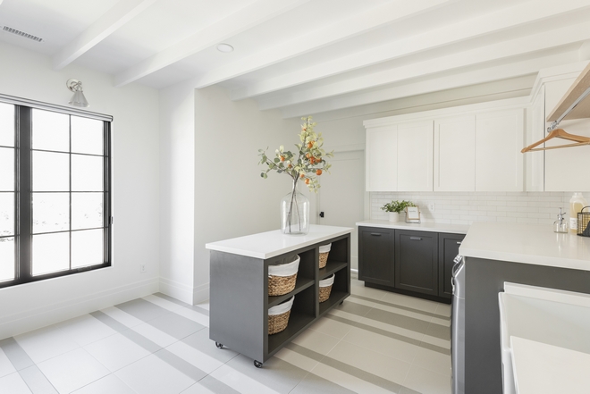 Laundry Room Large Laundry Room Flooring features white and grey porcelain tiles in a custom striped design and rolling island Flooring features white and grey porcelain tiles in a custom striped design Laundry Room Large Laundry Room Flooring features white and grey porcelain tiles in a custom striped design #Flooring #whiteandgreytile #porcelaintile #stripedtiledesign #LaundryRoom #LargeLaundryRoom