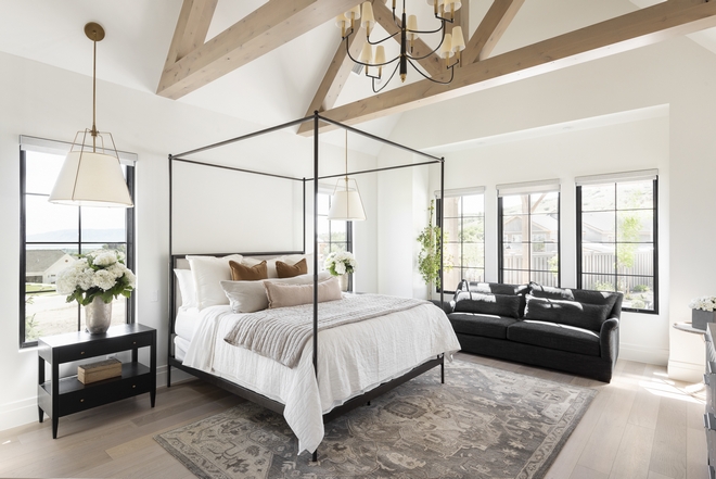 Vaulted ceilings with exposed trusses add character and warmth to this mountain-side bedroom Vaulted ceilings with exposed trusses add character and warmth to this mountain-side bedroom Vaulted ceilings with exposed trusses add character and warmth to this mountain-side bedroom #Vaultedceilings #exposedtrusses #trusses #ceiling #mountainsidebedroom #bedroom