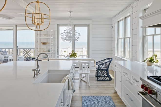 White interiors along with Serena & Lily's furniture gives this beach house a bright and sophisticated coastal vibe