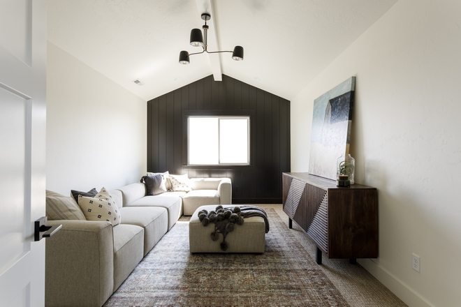 Family Room accentuated with black vertical shiplap in Sherwin Williams Caviar and added a white beam running throughout the vaulted ceiling Family Room accentuated with black vertical shiplap in Sherwin Williams Caviar and added a white beam running throughout the vaulted ceiling Family Room accentuated with black vertical shiplap in Sherwin Williams Caviar and added a white beam running throughout the vaulted ceiling Family Room accentuated with black vertical shiplap in Sherwin Williams Caviar and added a white beam running throughout the vaulted ceiling #FamilyRoom #blackshiplap #verticalshiplap #SherwinWilliamsCaviar #beam #vaultedceiling