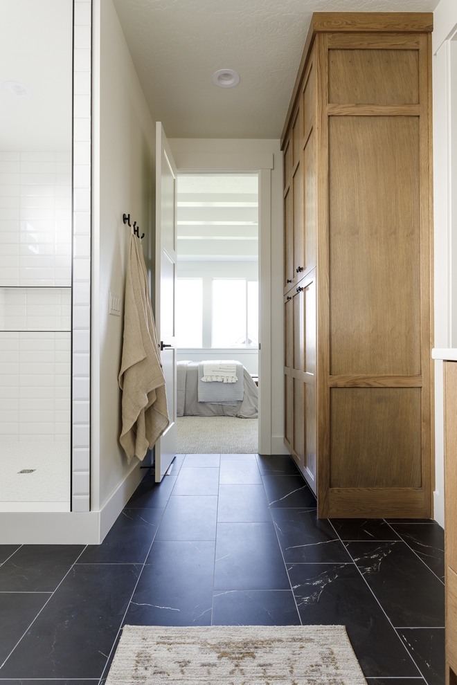 Master Bathroom features black marble-looking floor tile and Oak linen cabinet stained in Sherwin Williams Rustic Gray Master Bathroom features black marble-looking floor tile and Oak linen cabinet stained in Sherwin Williams Rustic Gray #MasterBathroom #Bathroom #blackmarble #marblelookingtile #floortile #Oak #linencabinet #SherwinWilliamsRusticGray