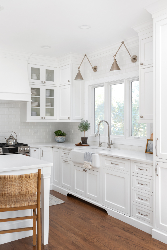 Kitchen Renovation Paneling the Subzero fridge helps with softening the weight of the large appliance as does the panel on the dishwasher Little details like the skirt on the toe area and the beautiful hood and island posts make this smaller work space truly special #kitchen #kitchenrenovation #kitchens